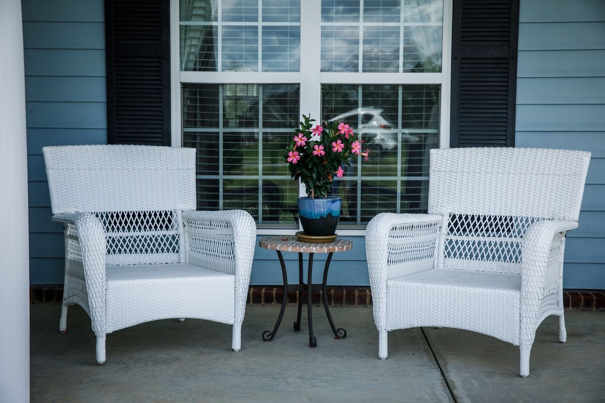 Front Porch Relaxation Wicker Chairs and Flowers
